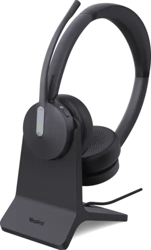 Yealink BH70 wireless headset on its charging stand